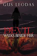 The Devil Walks Beside Her