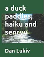 A duck paddles, haiku and senryu